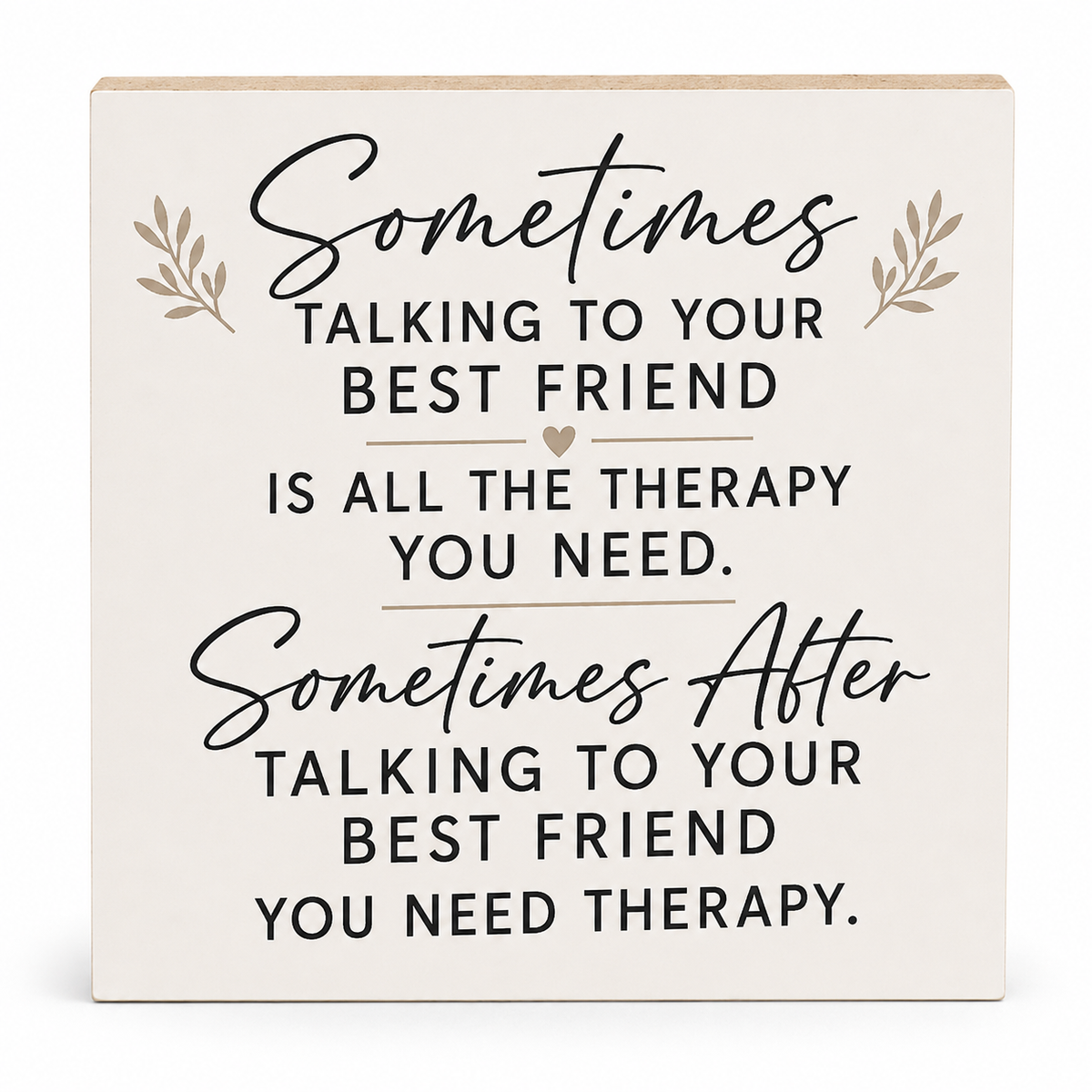 A square decorative wooden sign with a warm off-white background and printed therapy quote for best friends in black script and serif text, with small beige leaf illustrations.