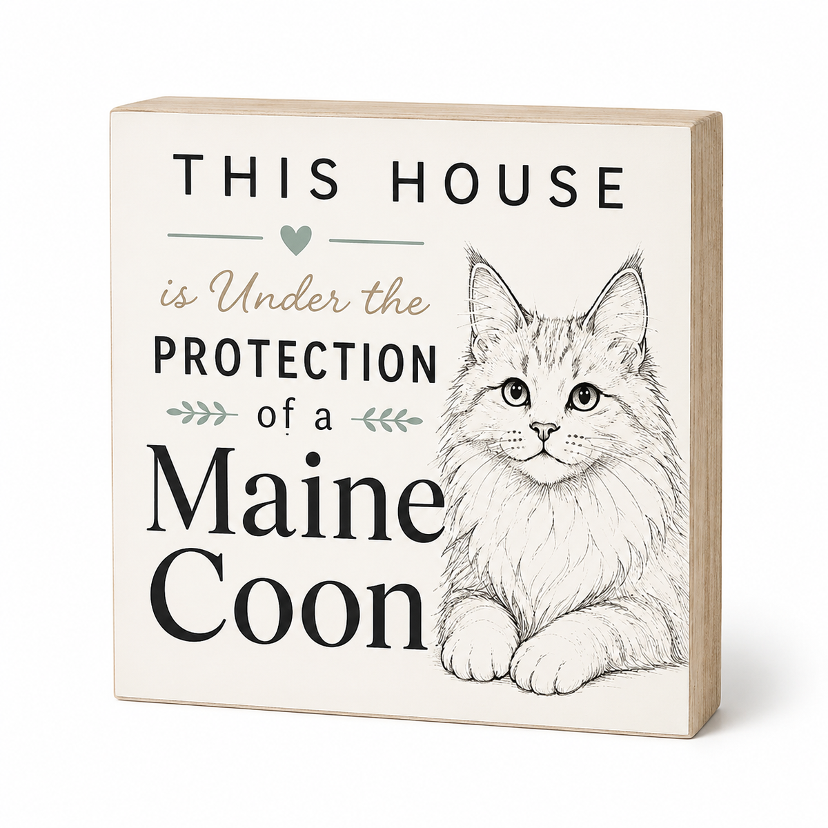 A square decorative wooden sign with a light natural wood edge and a cream face, featuring the text 'THIS HOUSE is Under the PROTECTION of a Maine Coon' alongside a detailed black-and-white sketch of a Maine Coon cat. The sign is photographed on a clean white background with a soft shadow.