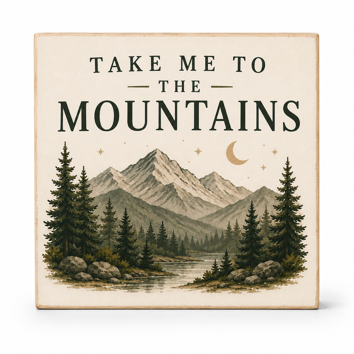 A square decorative sign with the phrase “TAKE ME TO THE MOUNTAINS” above an illustrated mountain landscape with pine trees, a river, rocks, stars, and a crescent moon. The sign has a warm cream background and is photographed against a clean white background.