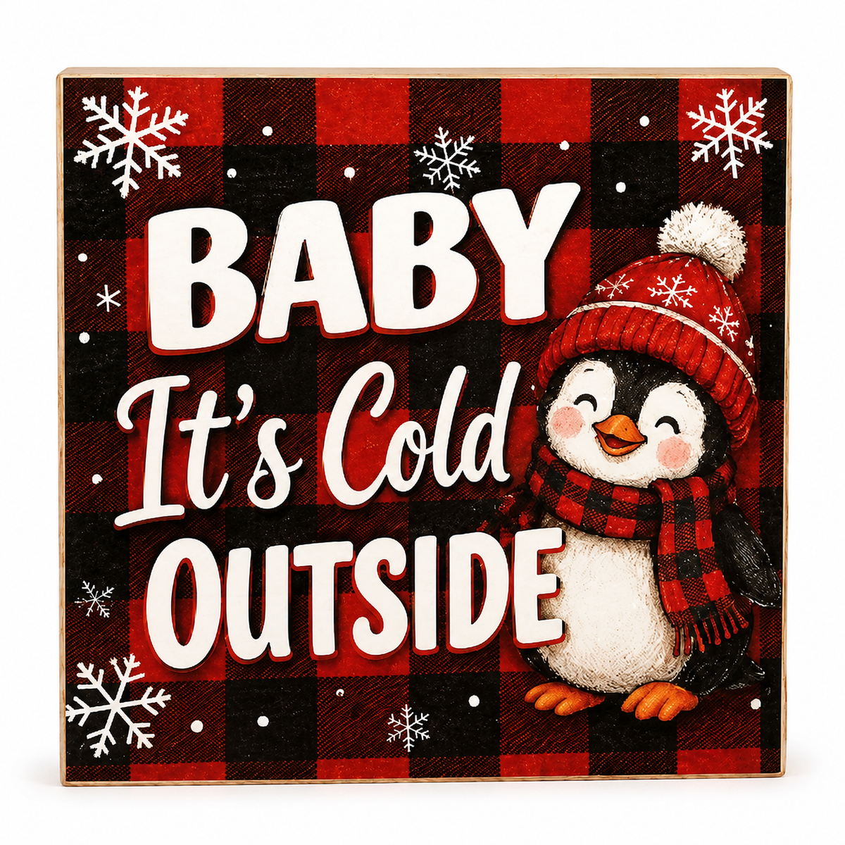 A square decorative sign with a red and black buffalo plaid background, white text reading “BABY It’s Cold OUTSIDE,” white snowflakes, and a cartoon penguin wearing a red plaid hat and scarf.