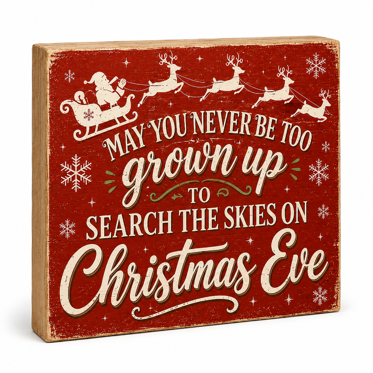 A square rustic Christmas sign with a distressed red background and cream lettering that reads, 'MAY YOU NEVER BE TOO grown up TO SEARCH THE SKIES ON Christmas Eve,' with Santa and reindeer illustrations near the top.