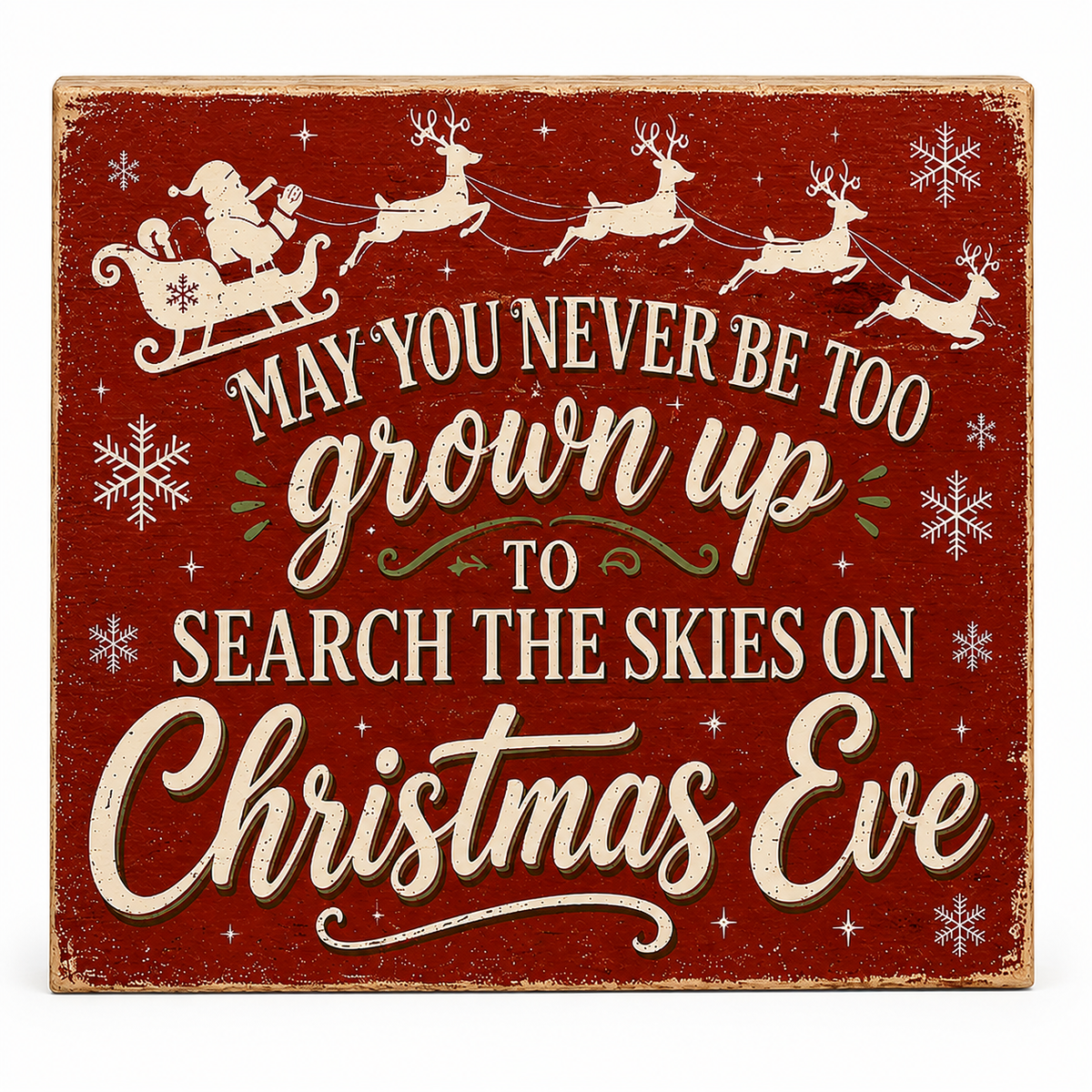 A square red wooden Christmas sign with distressed edges, featuring Santa in a sleigh, reindeer, snowflakes, and the phrase “MAY YOU NEVER BE TOO grown up TO SEARCH THE SKIES ON Christmas Eve” in cream lettering.
