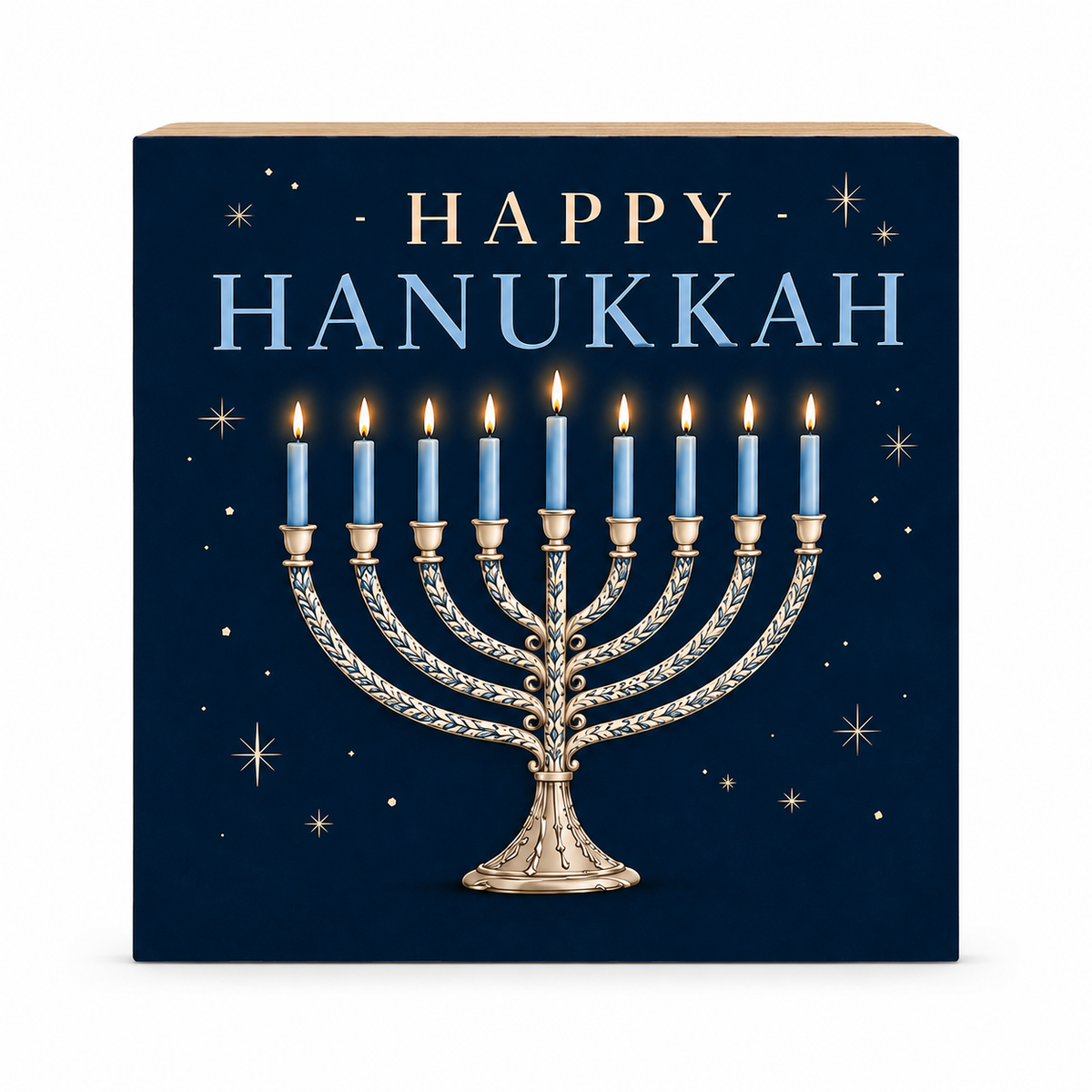 Square decorative sign with a Hanukkah design, featuring the words “HAPPY HANUKKAH” in gold and light blue above a detailed gold menorah with lit blue candles on a dark navy background with small gold stars.