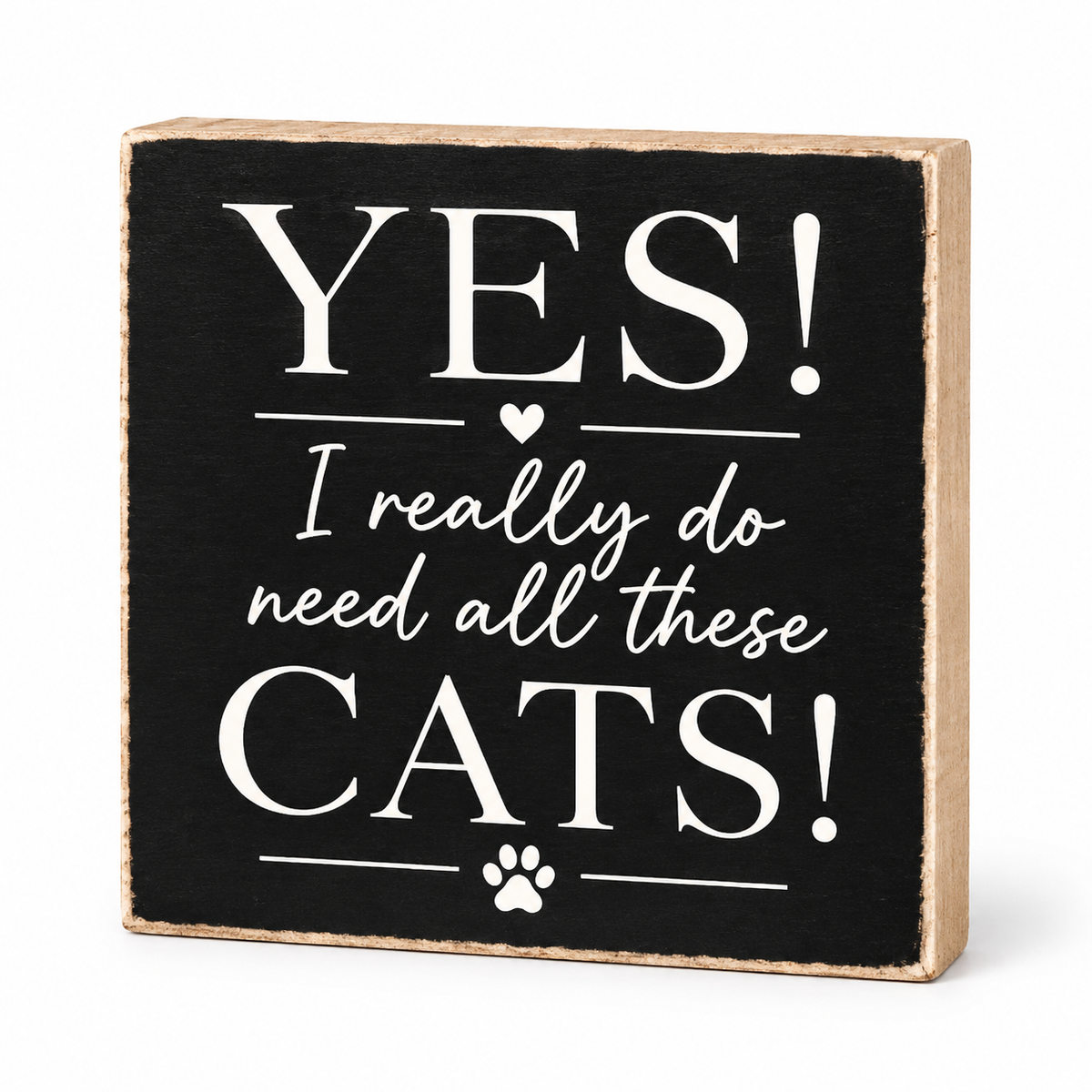 A square decorative wooden sign with a black face and natural wood edges, printed with the phrase “YES! I really do need all these CATS!” in white lettering, shown on a white background.