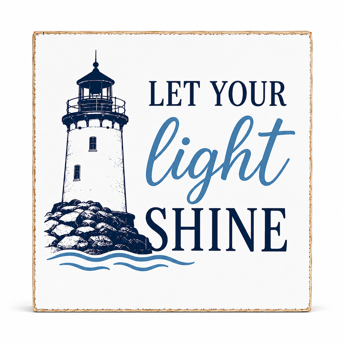 A square decorative wall sign with a distressed wood border, featuring a navy blue lighthouse illustration and the phrase 'LET YOUR light SHINE' on a white background.