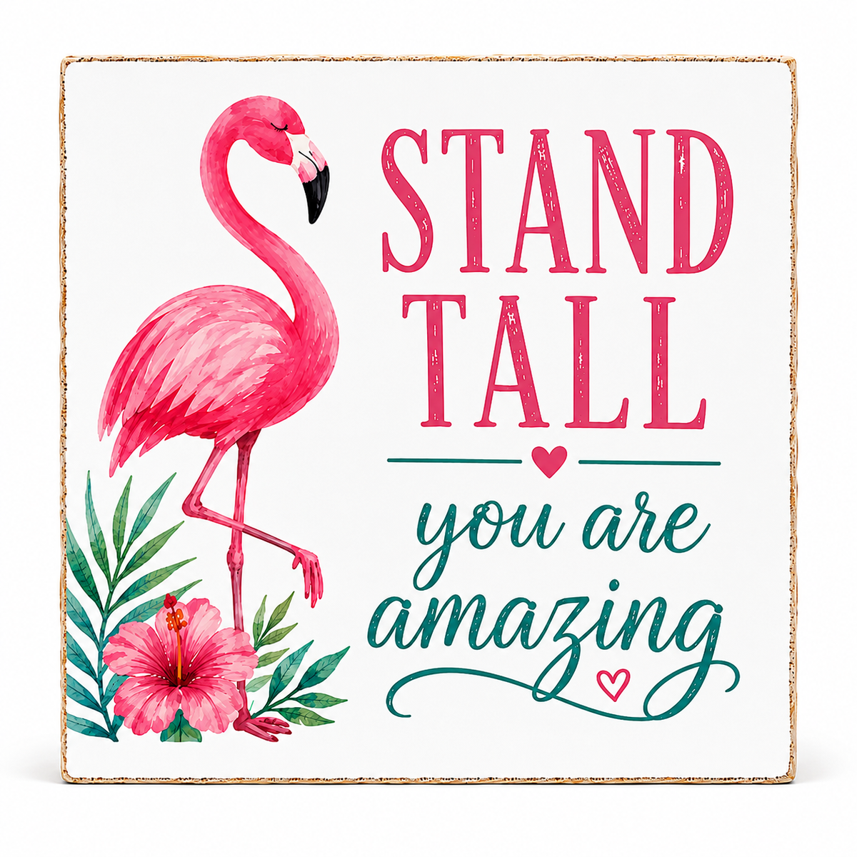 Square decorative wall sign with a flamingo illustration, tropical leaves, and pink and teal text reading “STAND TALL you are amazing” on a white background with a distressed wood edge.