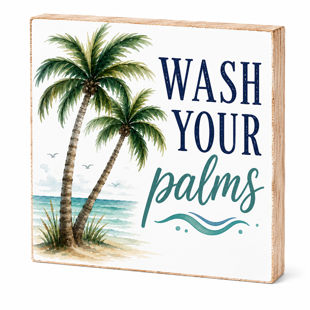 A square decorative wooden sign with a light natural wood frame and a white face, featuring two palm trees by the ocean and the phrase “WASH YOUR palms” in navy and teal lettering.