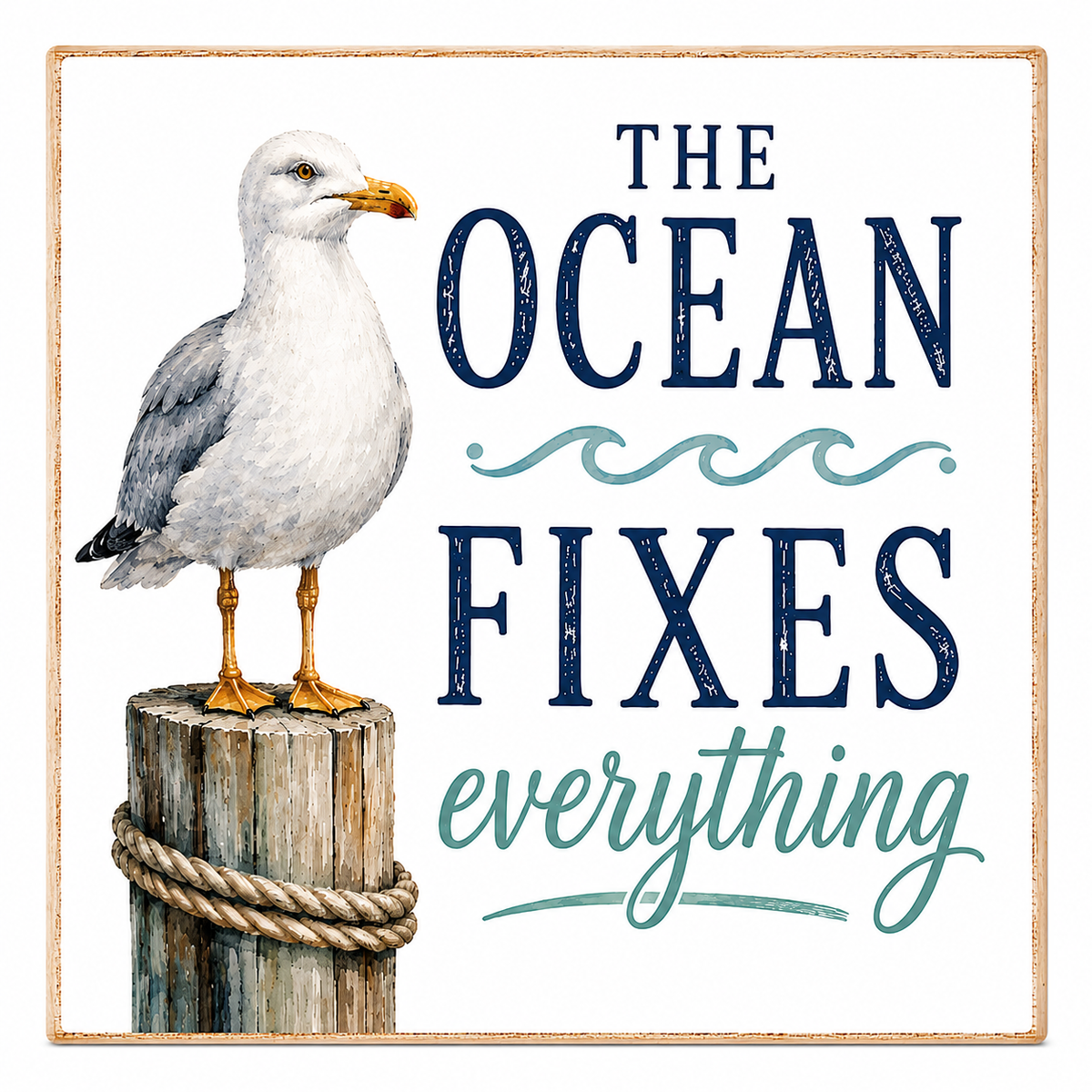 Square decorative sign with a watercolor-style seagull perched on a rope-bound wooden post, next to the phrase “THE OCEAN FIXES everything” in navy and teal lettering on a white background with a thin tan border.