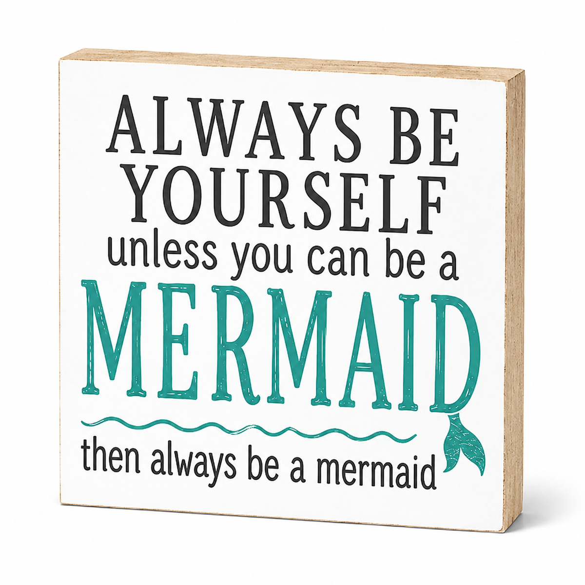 A square decorative wooden sign with a white face and natural wood edges, featuring the phrase 'ALWAYS BE YOURSELF unless you can be a MERMAID then always be a mermaid' in black and teal lettering.