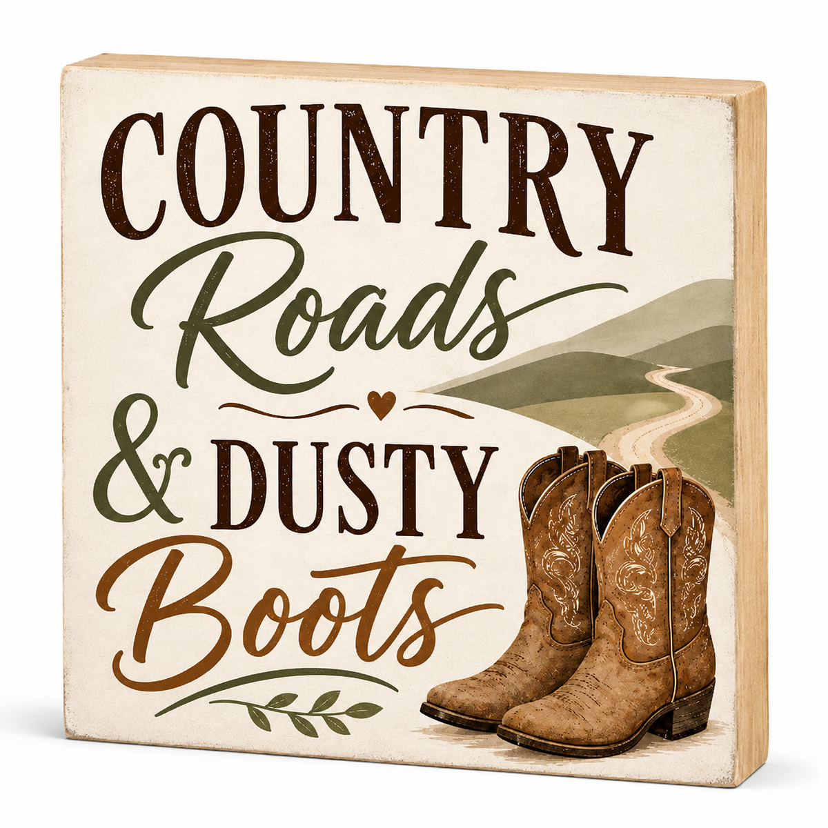 A square decorative wooden sign with the phrase 'COUNTRY Roads & DUSTY Boots' in dark brown and olive green lettering, featuring a painted landscape and a pair of brown cowboy boots on the front, shown on a white background.