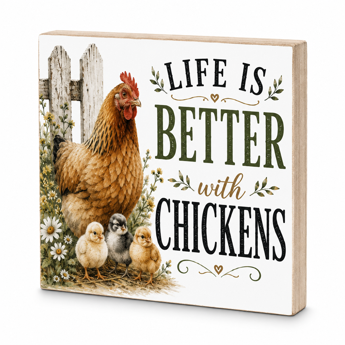 A square decorative wooden sign with a light natural wood edge and a white front panel. The panel shows an illustration of a brown hen with two chicks beside a white picket fence, with the text 'LIFE IS BETTER with CHICKENS' in black and dark green lettering with small floral accents.