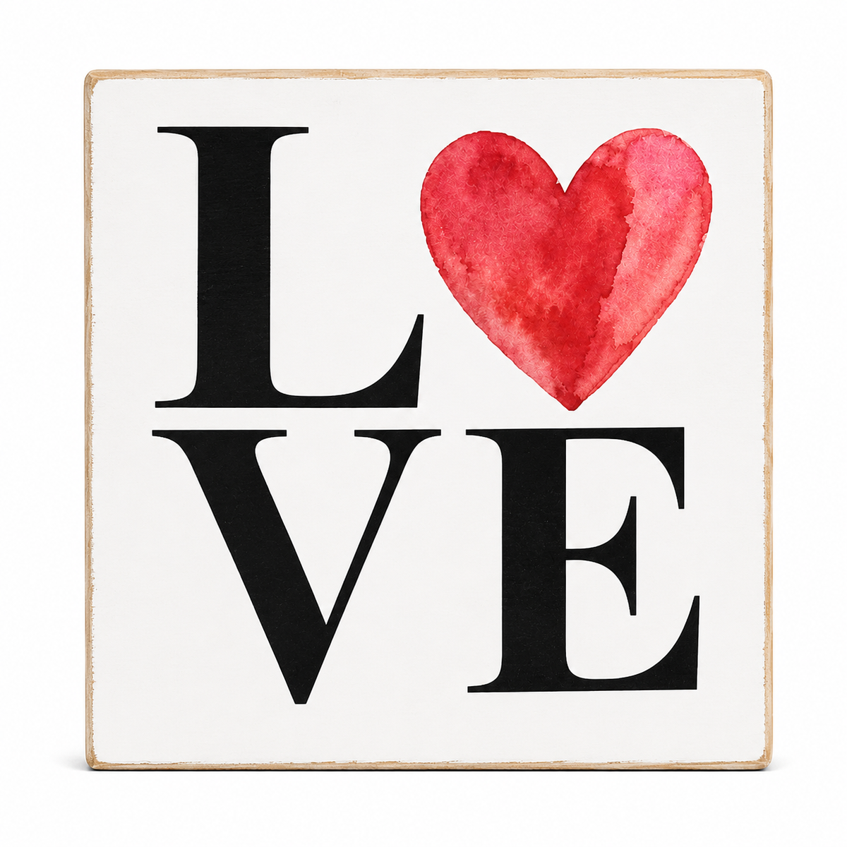 A square decorative sign with a white face, black serif letters spelling LOVE, and a red watercolor heart replacing the O. The sign has a light natural wood border and is photographed against a plain white background.