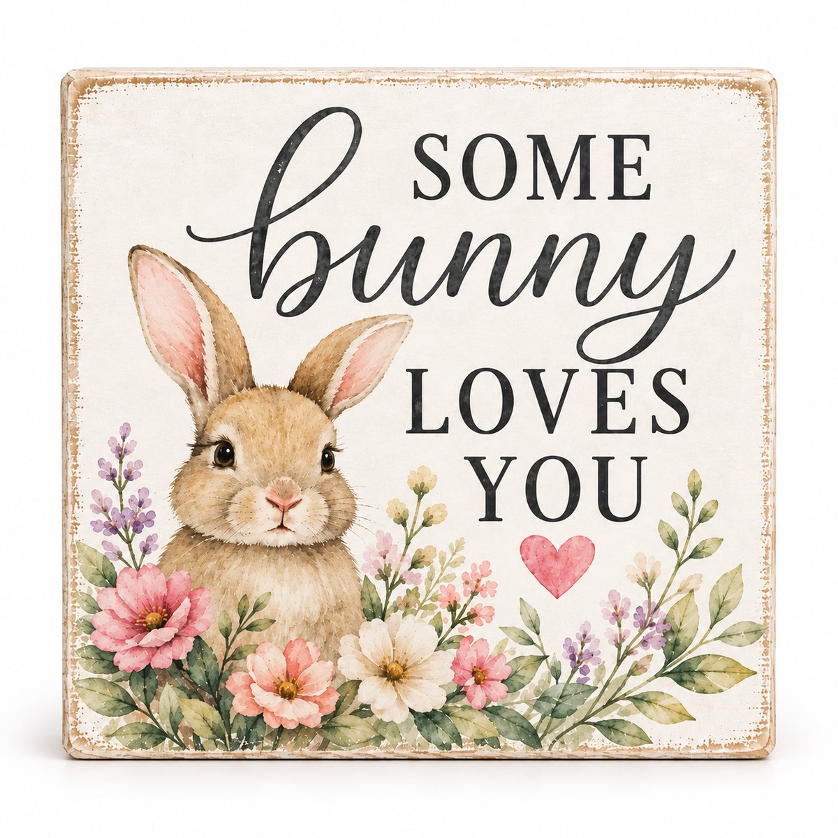 Square decorative sign with a watercolor-style bunny surrounded by flowers and the phrase “SOME bunny LOVES YOU” in black script and block lettering on a warm off-white background.