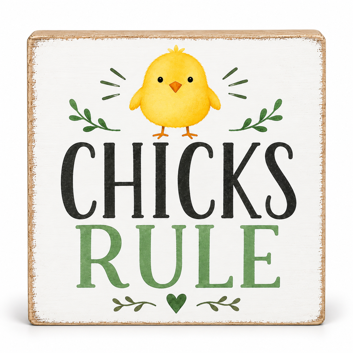 A square decorative sign with a distressed white face and natural wood edges, featuring a yellow chick illustration above the words “CHICKS RULE” in black and green lettering.
