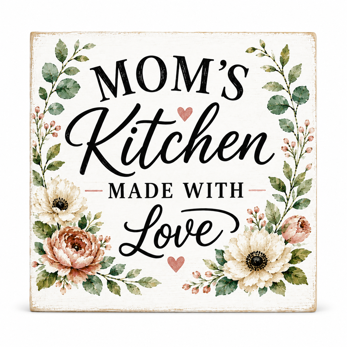 A square decorative sign with a distressed white background featuring the phrase 'MOM'S Kitchen MADE WITH Love' in black script and serif lettering, surrounded by watercolor-style flowers and green leaves.