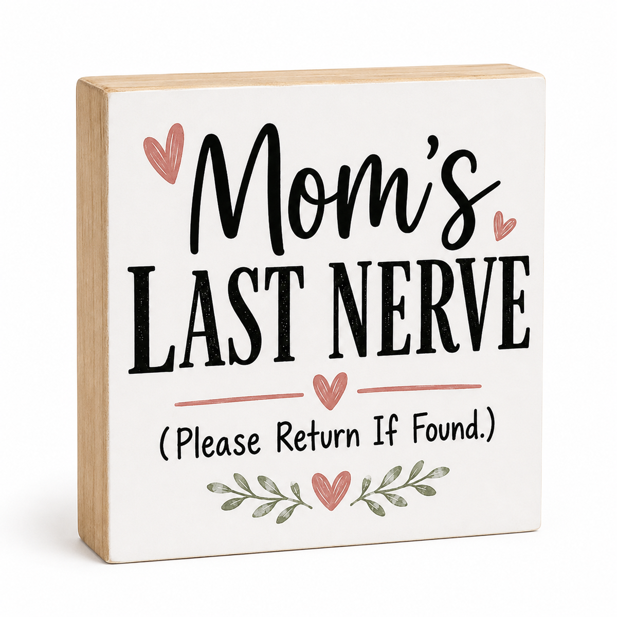 A square wooden sign with a white face and natural wood edges, printed with the phrase 'Mom's Last Nerve (Please Return If Found.)' in black lettering, decorated with pink hearts and green leafy stems, shown on a white background.