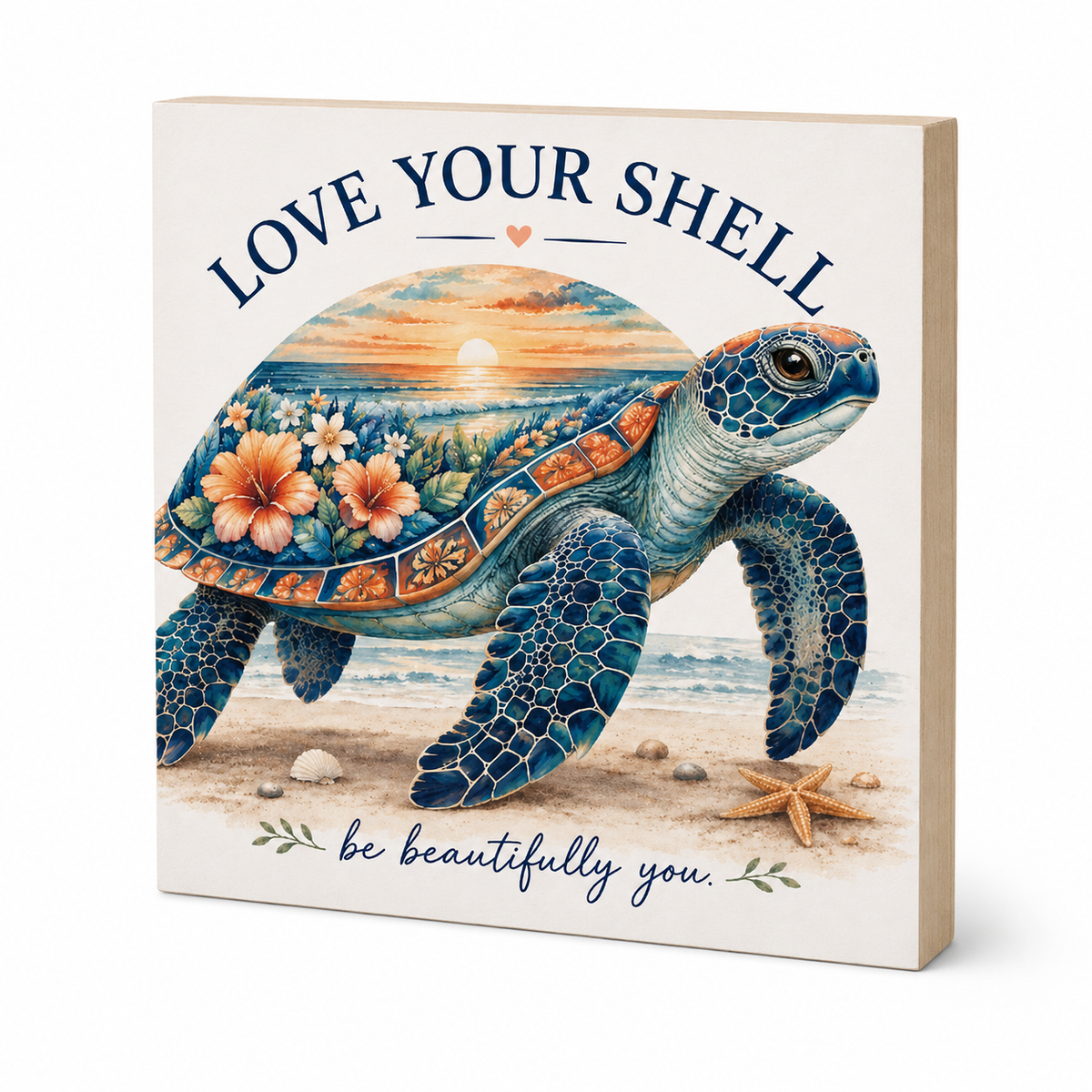 A square decorative wall sign with a light wood edge and cream face, featuring an illustrated sea turtle on a beach with the text 'LOVE YOUR SHELL' above and 'be beautifully you.' below.
