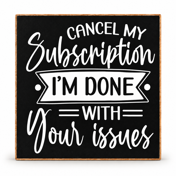 A square decorative sign with a black face, white typographic text reading 'CANCEL MY Subscription I'M DONE WITH your issues,' and a natural wood border, shown on a light gray background.