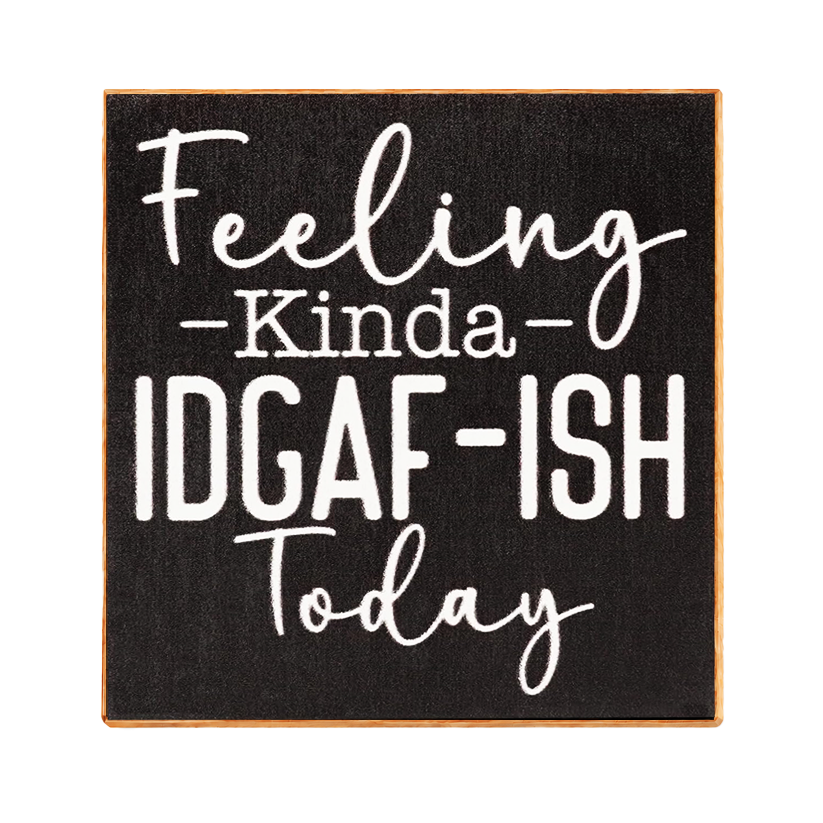 A square decorative sign with a black textured face, white lettering that reads 'Feeling kinda IDGAF-ISH today,' and a thin natural wood border on a white background.