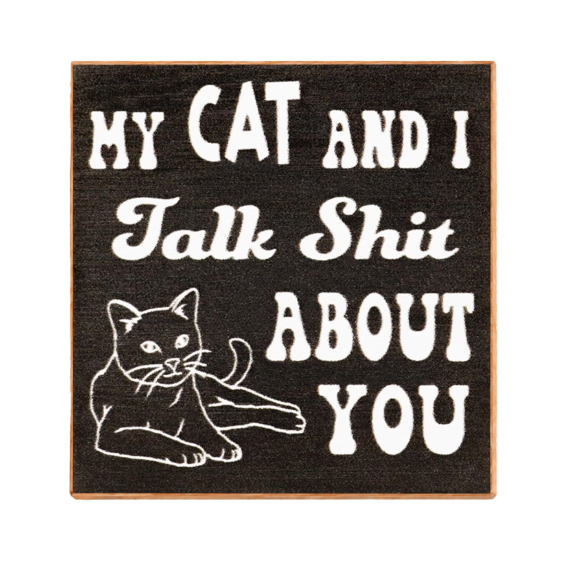 A square black decorative sign with a light wood border, featuring white text that reads 'MY CAT AND I Talk Shit ABOUT YOU' and a white line drawing of a cat, shown on a plain white background.