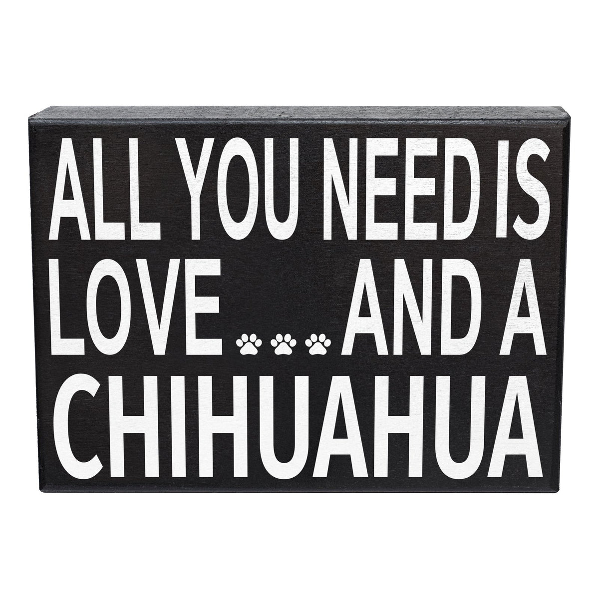A rectangular black decorative sign with bold white text reading 'ALL YOU NEED IS LOVE.
