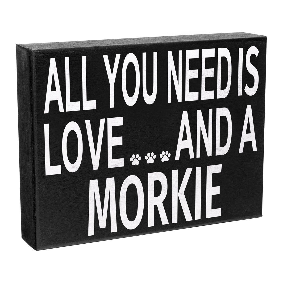 A black wooden sign with the text 'All you need is LOVE and a MORKIE' in white letters, along with a paw print symbol.