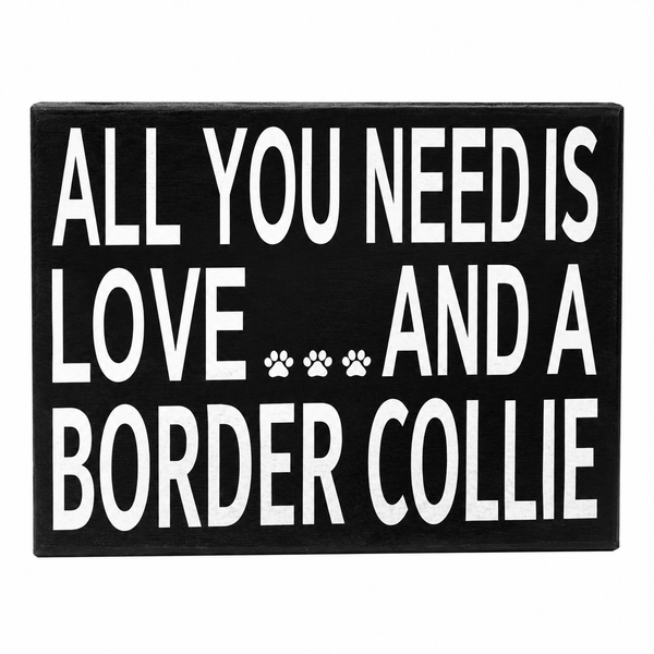 A rectangular black sign with bold white text reading 'ALL YOU NEED IS LOVE.