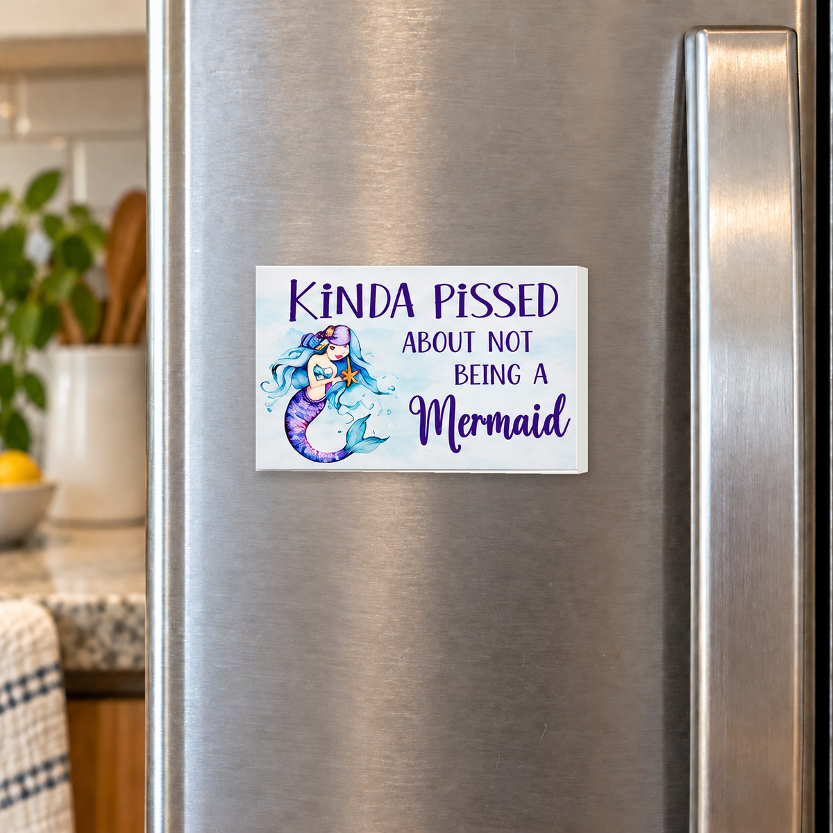 Kinda Pissed About Not Being a Mermaid rectangular magnet shown front-facing on a refrigerator.
