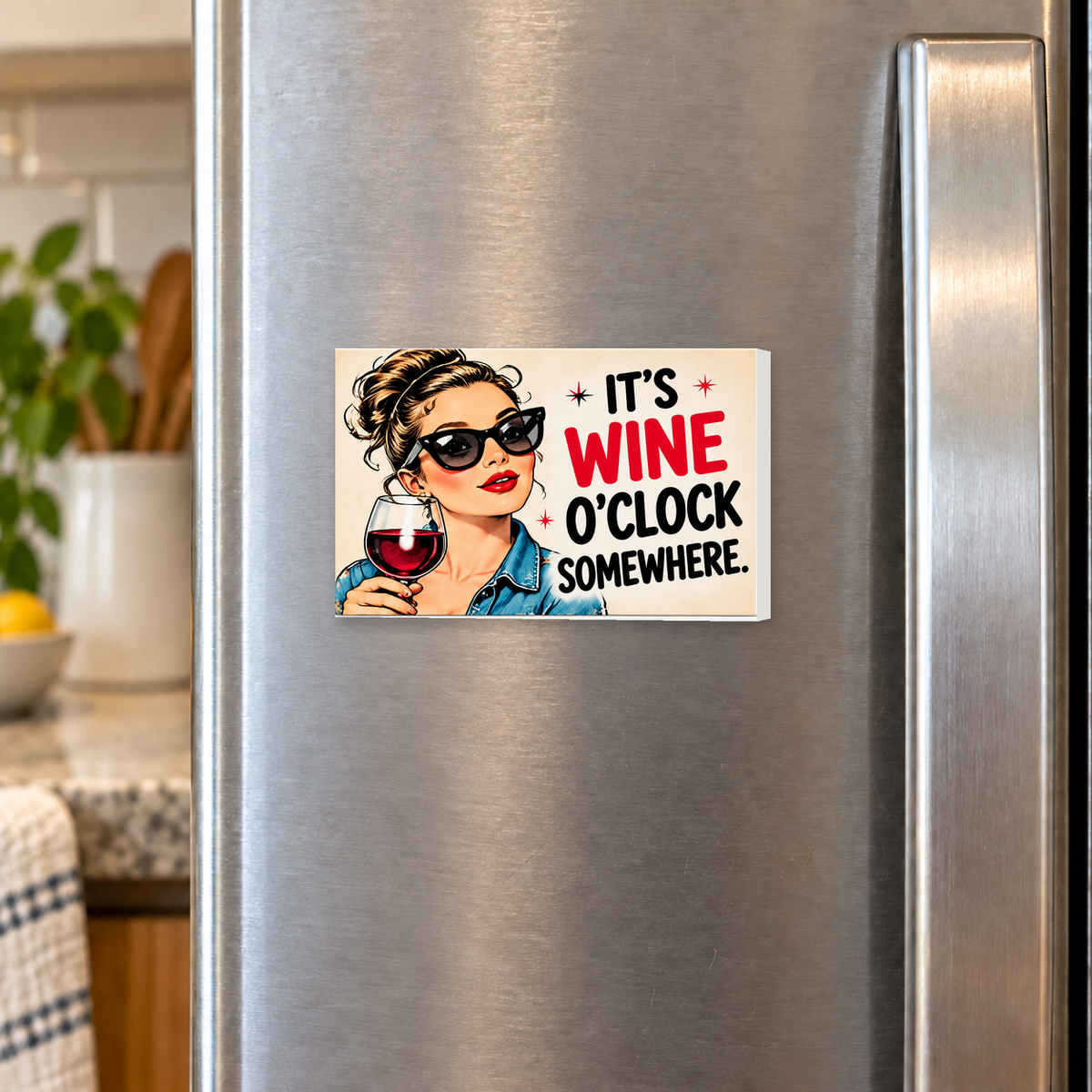 It's Wine O'Clock Somewhere. rectangular magnet shown front-facing on a refrigerator.