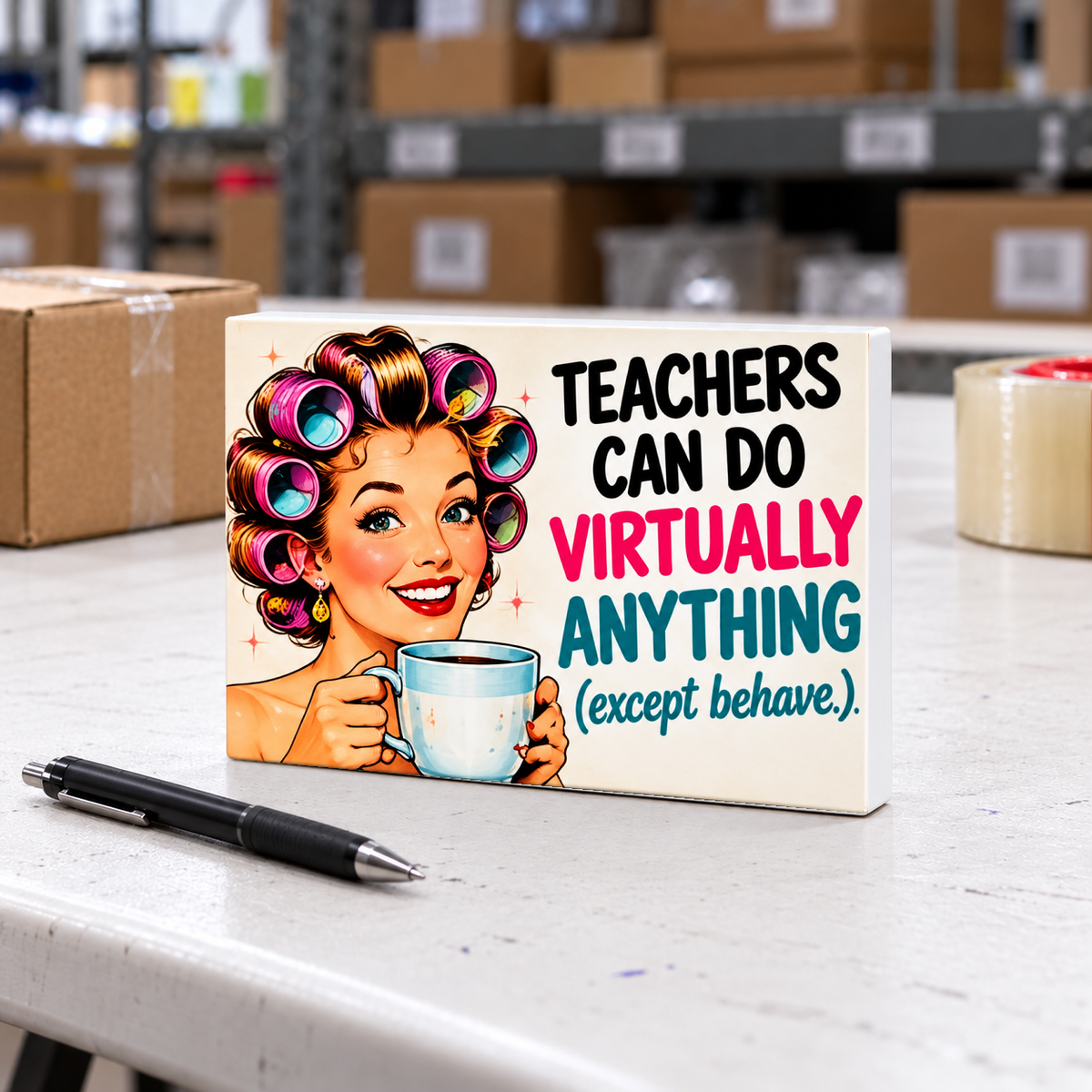 Teachers Can Do Virtually Anything (Except Behave) magnet and mini sign on a white folding warehouse table.
