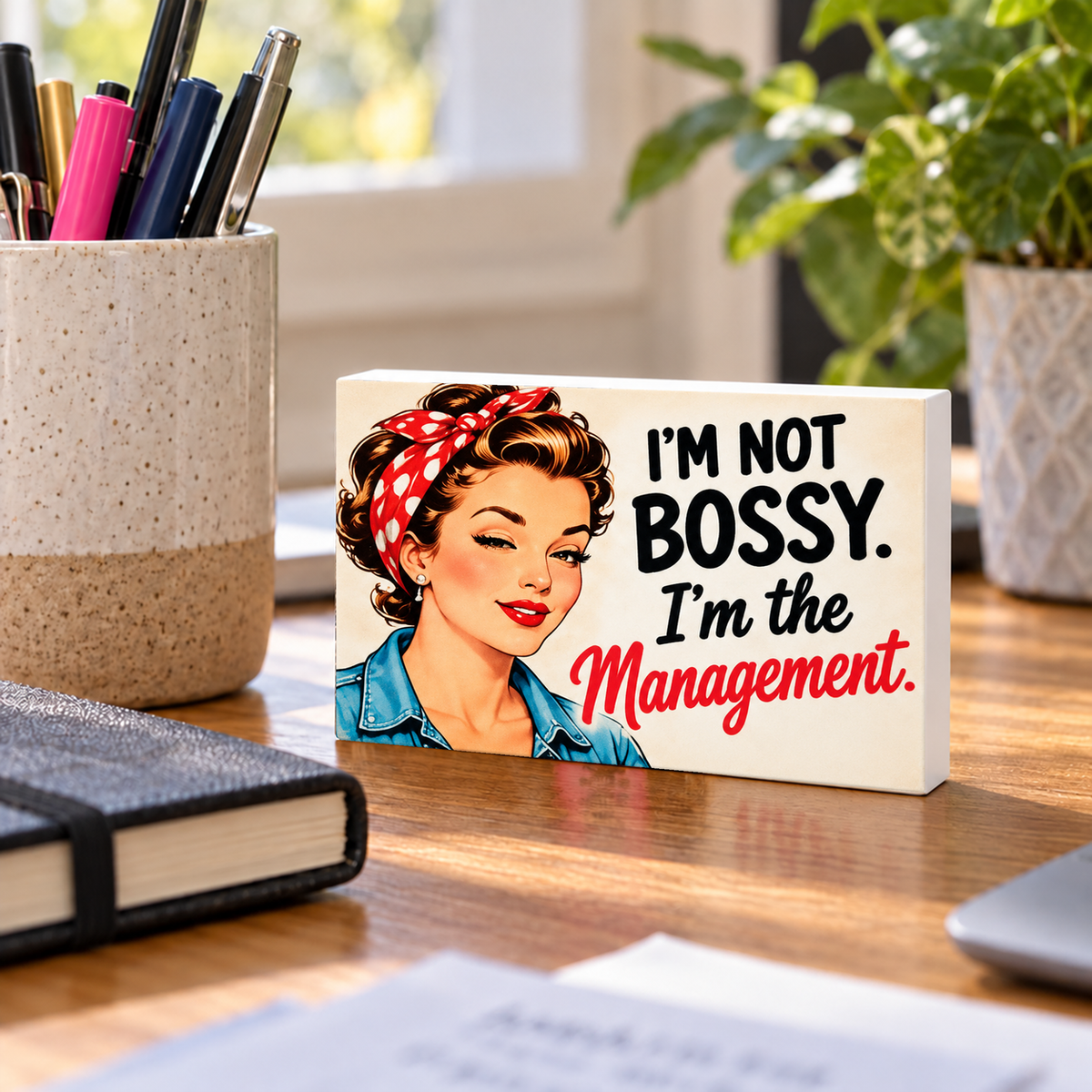 I'm Not Bossy. I'm the Management. mini sign standing on a desk with white PVC edges.