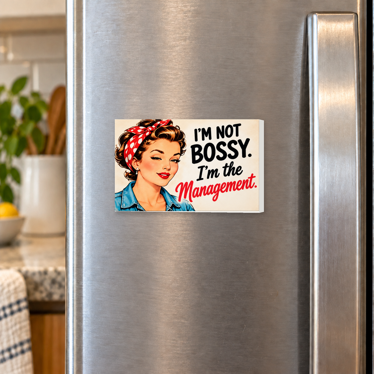 I'm Not Bossy. I'm the Management. rectangular magnet shown front-facing on a refrigerator.