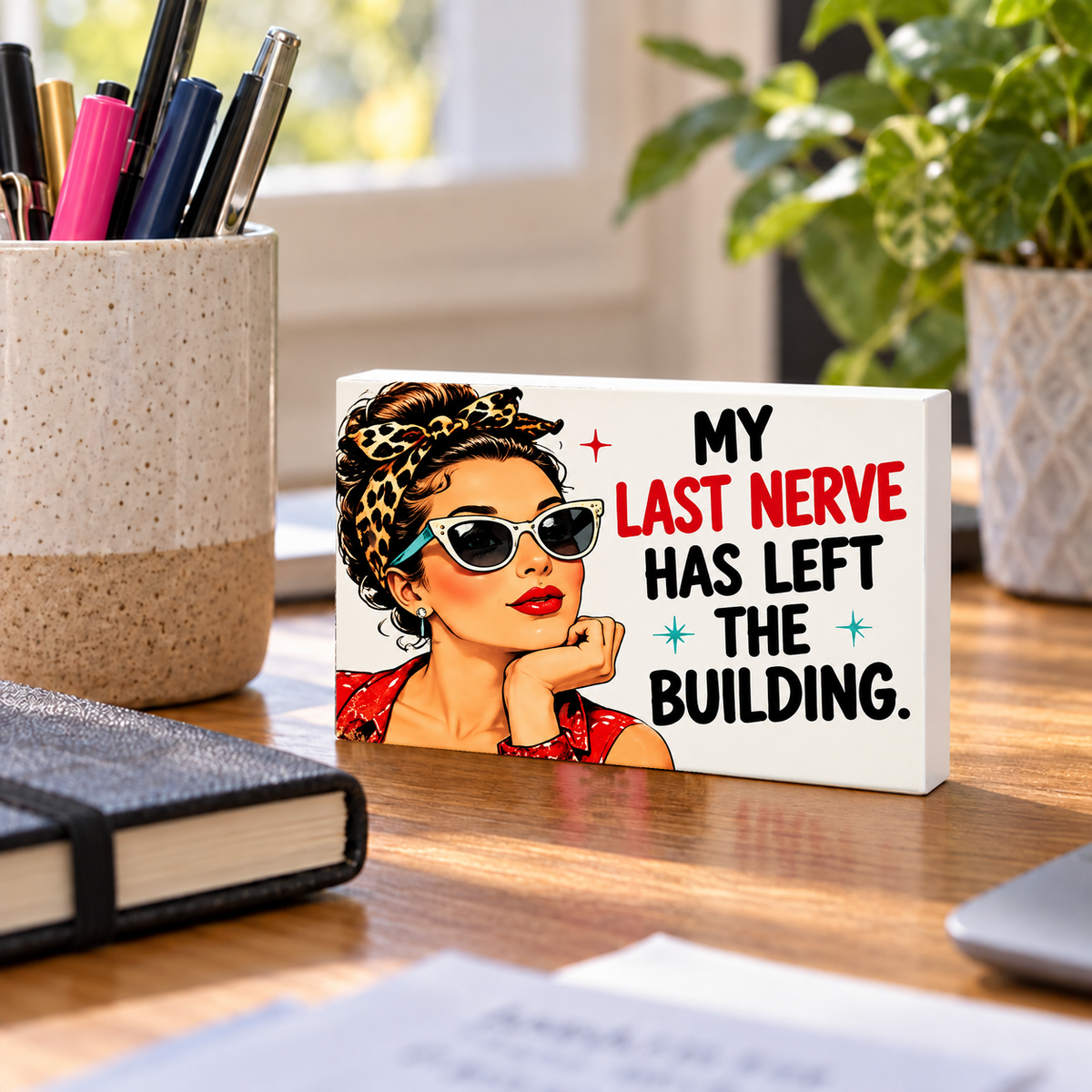My Last Nerve Has Left the Building mini sign standing on a desk with white PVC edges.
