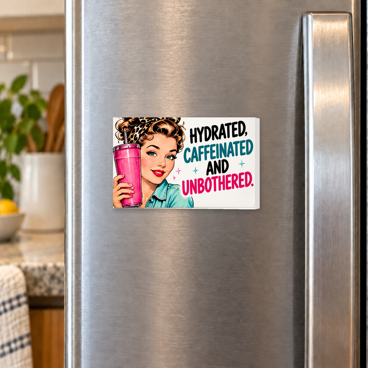 Hydrated, Caffeinated and Unbothered rectangular magnet on a refrigerator.