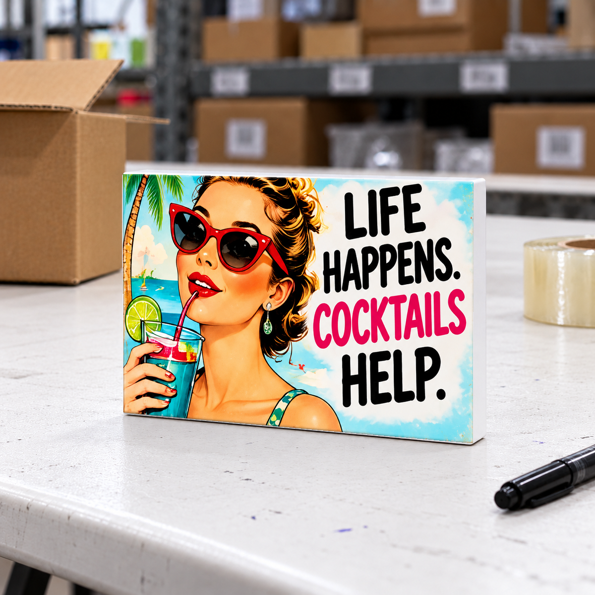 Life Happens. Cocktails Help magnet and mini sign on a white folding warehouse table.
