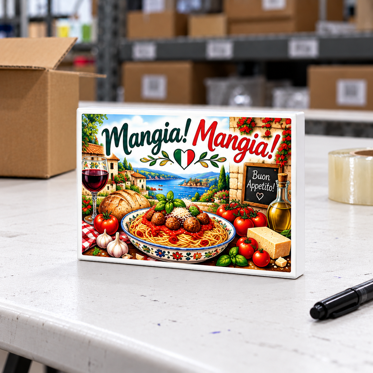Italian Kitchen – Mangia! Mangia! magnet and mini sign on a white folding warehouse table.