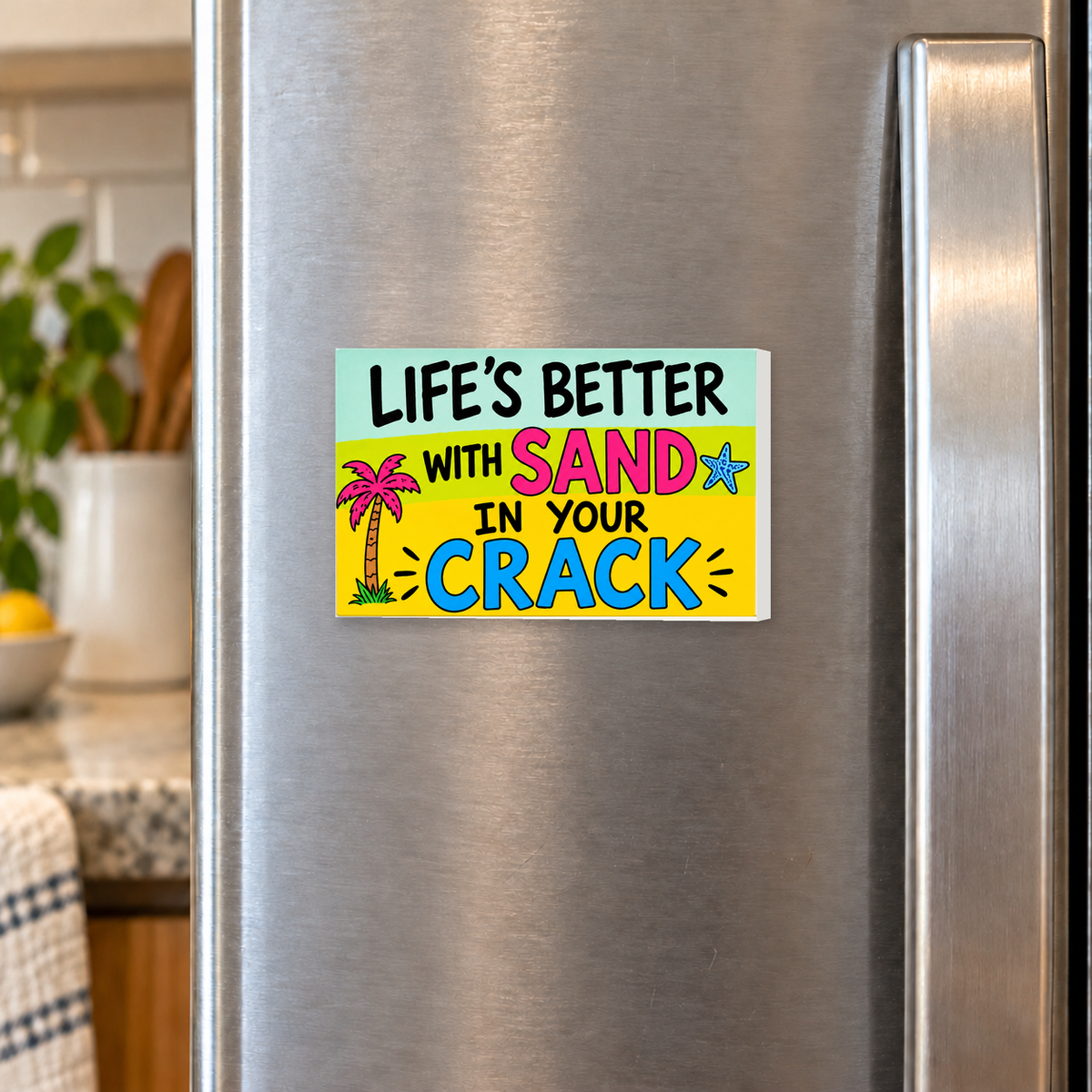 Life’s Better With Sand in Your Crack rectangular magnet shown front-facing on a refrigerator.