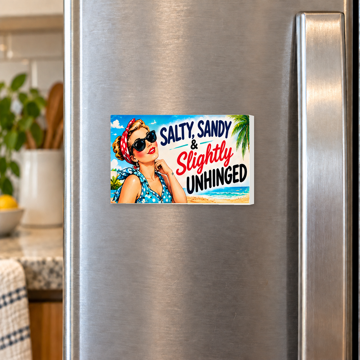 Salty, Sandy & Slightly Unhinged rectangular magnet shown front-facing on a refrigerator.