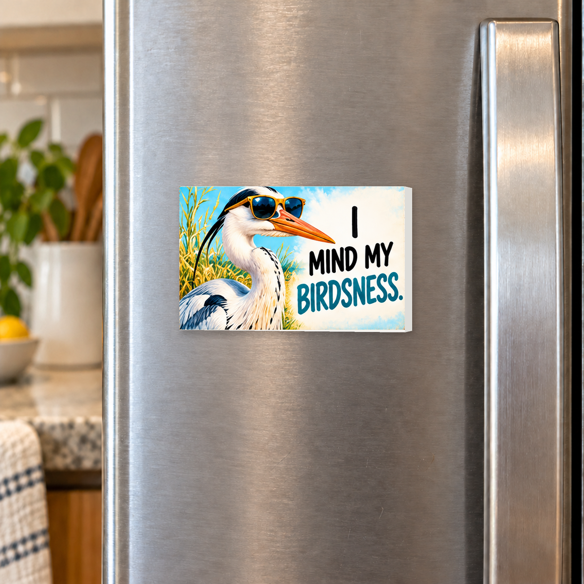 I Mind My Birdsness rectangular magnet on a refrigerator.