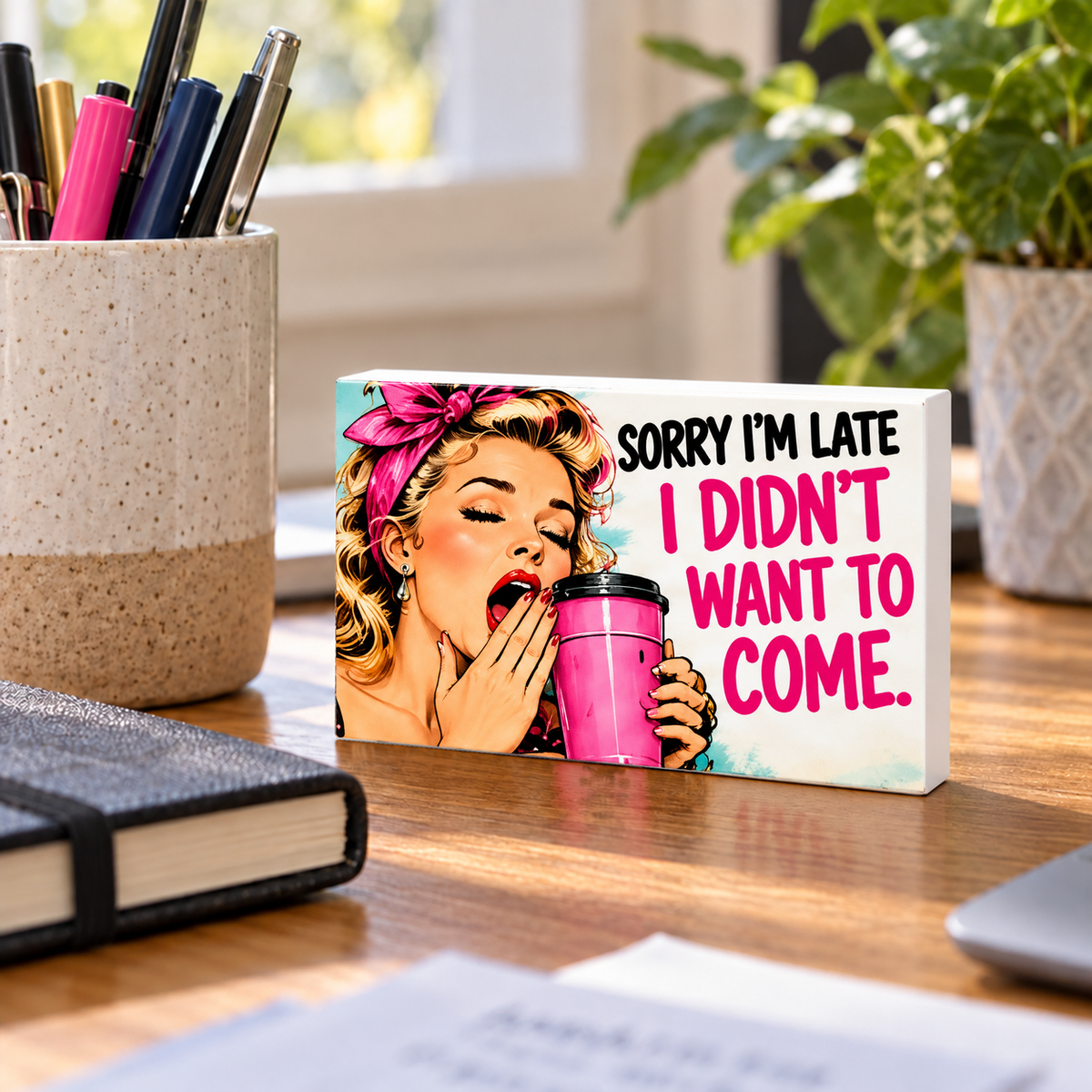 Sorry I’m Late I Didn’t Want to Come mini sign standing on a desk with white PVC edges.