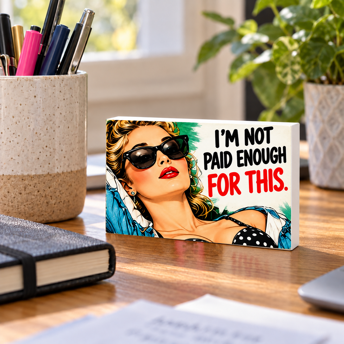 I'm Not Paid Enough for This mini sign standing on a desk with white PVC edges.