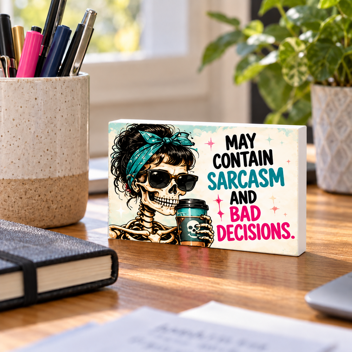 May Contain Sarcasm and Bad Decisions mini sign standing on a desk with white PVC edges.