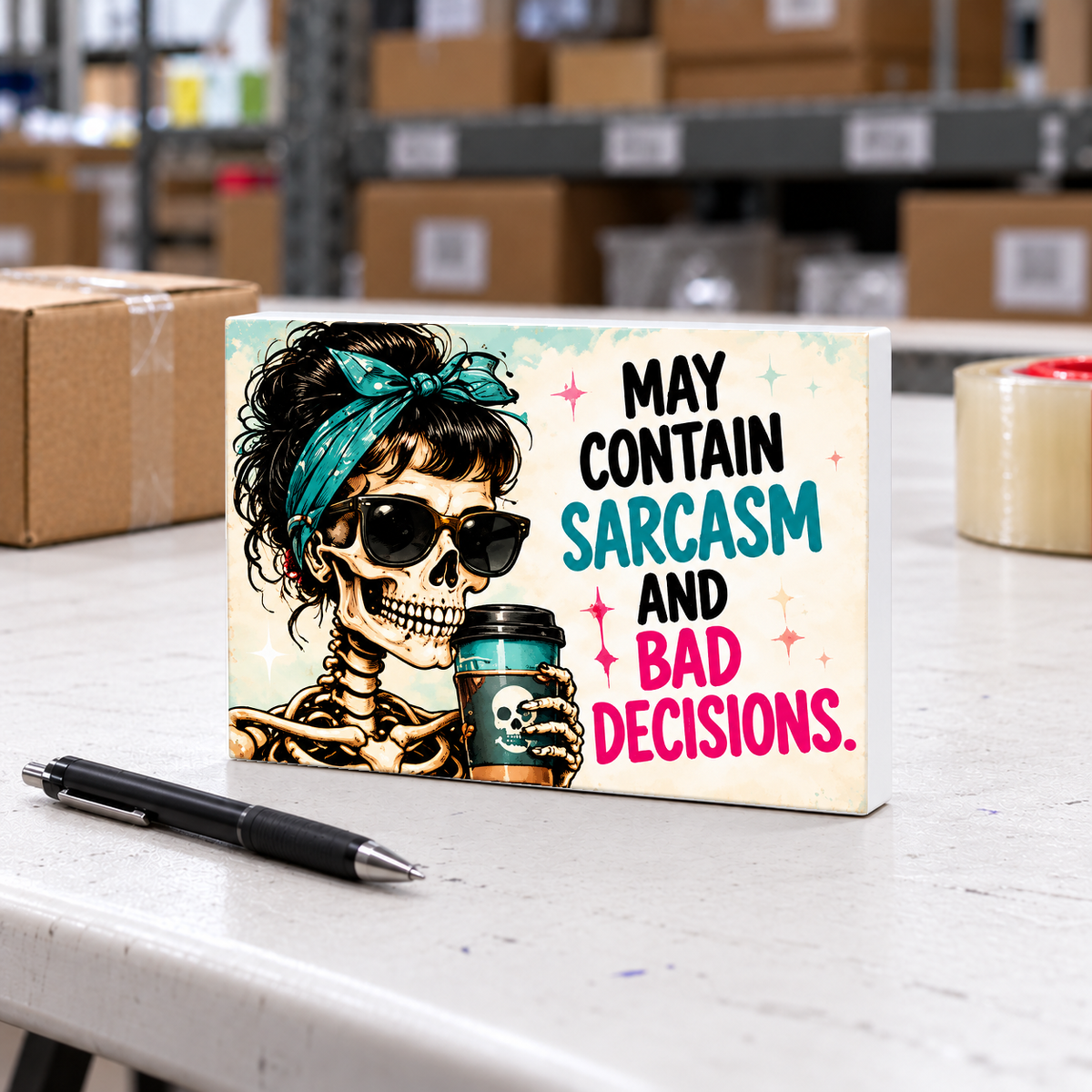 May Contain Sarcasm and Bad Decisions magnet and mini sign on a white folding warehouse table.