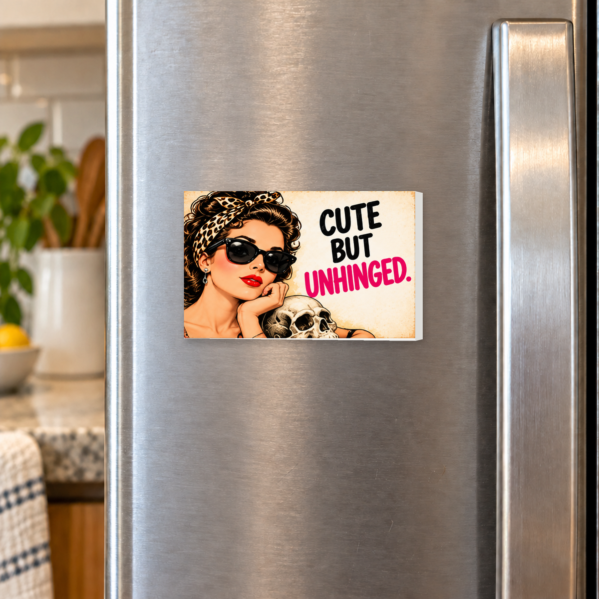 Cute But Unhinged rectangular magnet shown front-facing on a refrigerator.