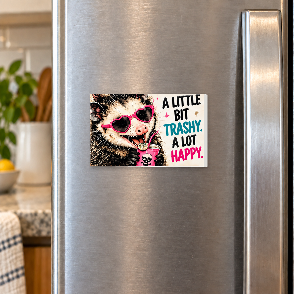 A Little Bit Trashy A Lot Happy rectangular magnet shown front-facing on a refrigerator.