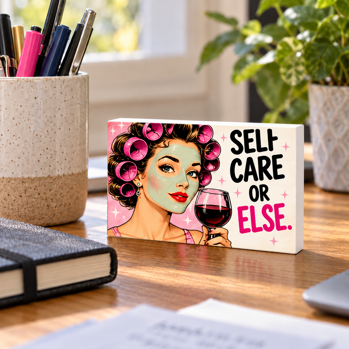 Self Care or Else mini sign standing on a desk with white PVC edges.