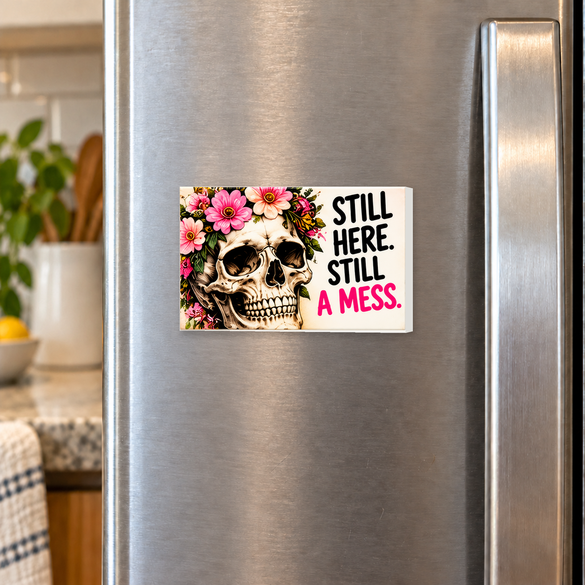 Still Here Still a Mess rectangular magnet shown front-facing on a refrigerator.