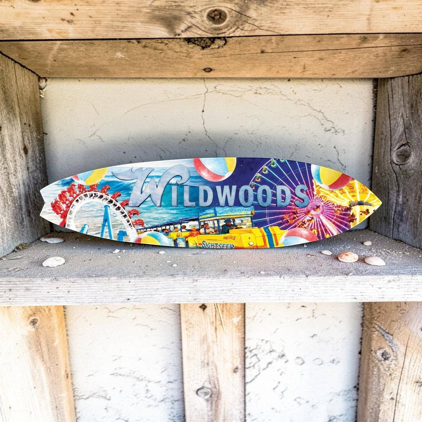 FUN HAPPY STUFF by jennygems Wildwoods decorative surfboard wall art featuring a colorful boardwalk and beach graphic.