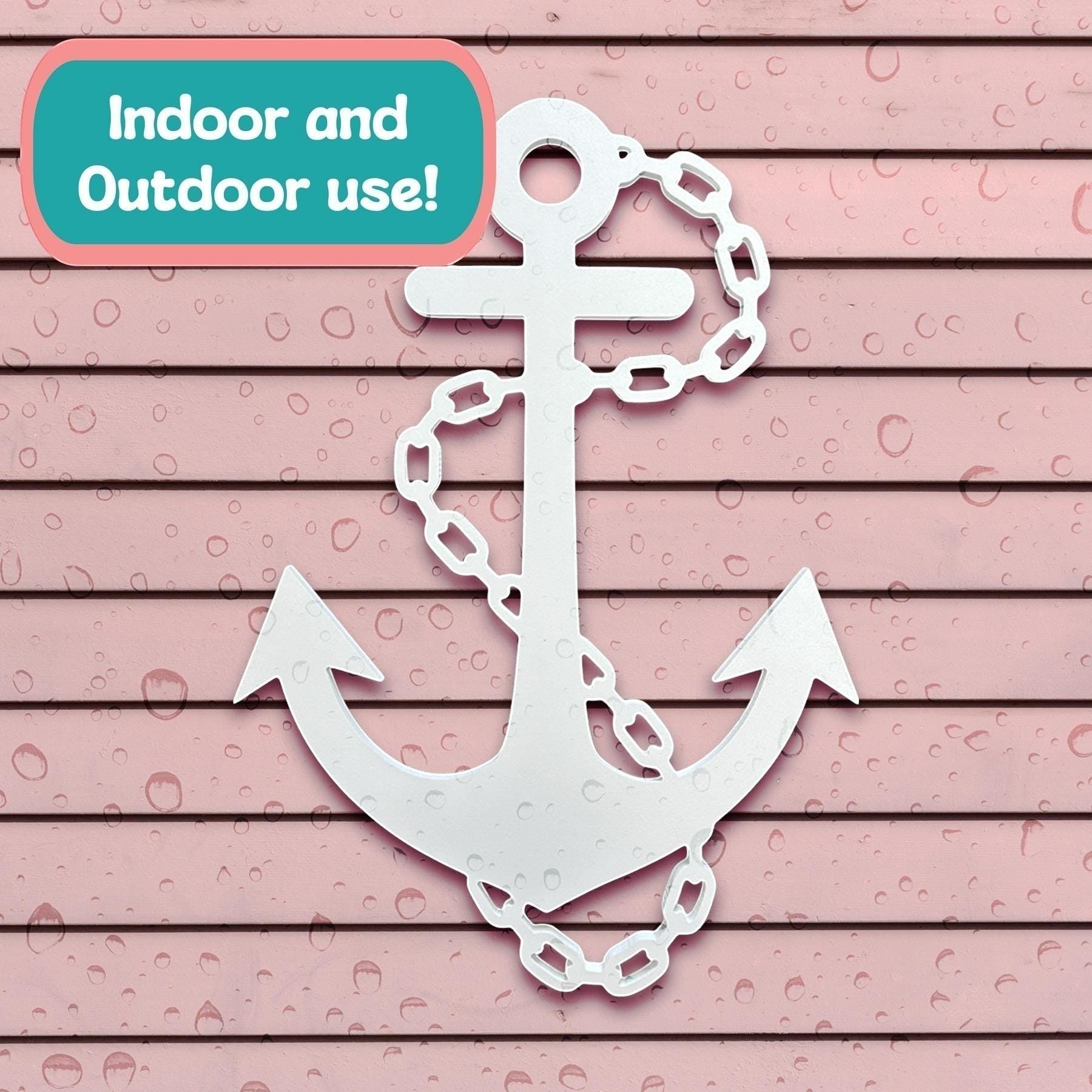 white nautical anchor wall decor with chain detail on pink horizontal siding