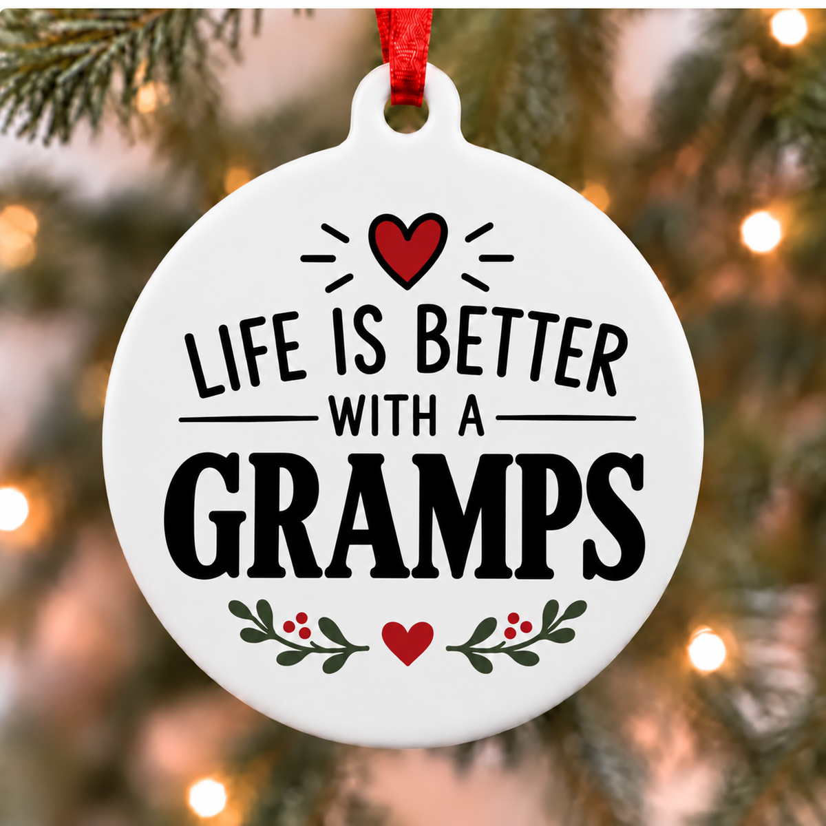 Life Is Better With a Gramps PVC Christmas ornament hanging close up on a tree with a red ribbon